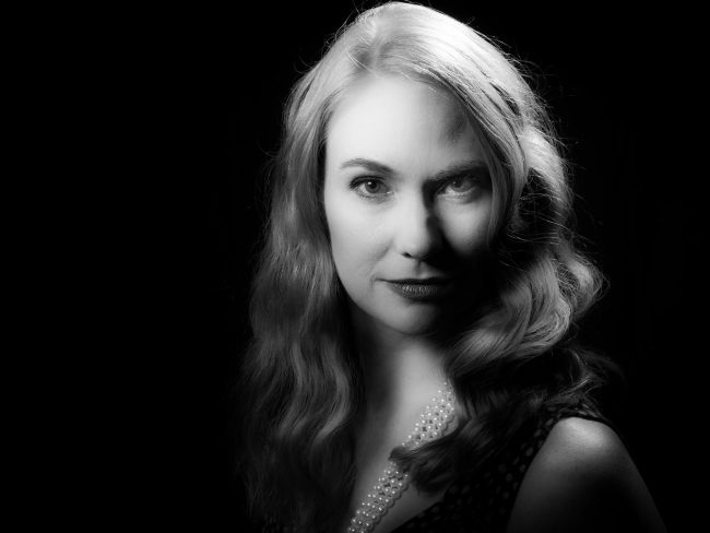 black and white studio portrait of a female model