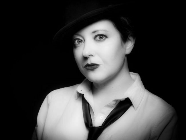 black and white studio portrait of a female model